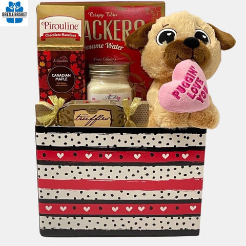 Finest Love gift baskets Calgary offers-This beautiful ombre hearts gift basket comes with an adorable teddy with delicious gourmet food snacks..
