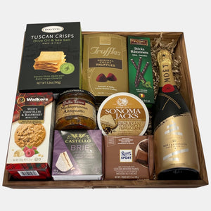 Finest champagne gift basket Calgary offers. It includes a bottle of champagne & delicious gourmet snacks in a large wooden tray to be enjoyed all round the year..