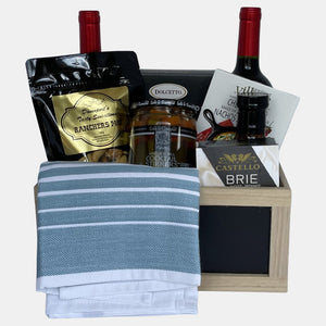 Made in a wooden crate, this perfect made in Calgary housewarming gift basket includes 2 bottles of wine and tasty gourmet snacks. 