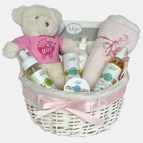 This Calgary baby gift basket includes quality baby products, pink colored blanket and a "It's a girl" white teddy packed in a beautiful round white basket. 