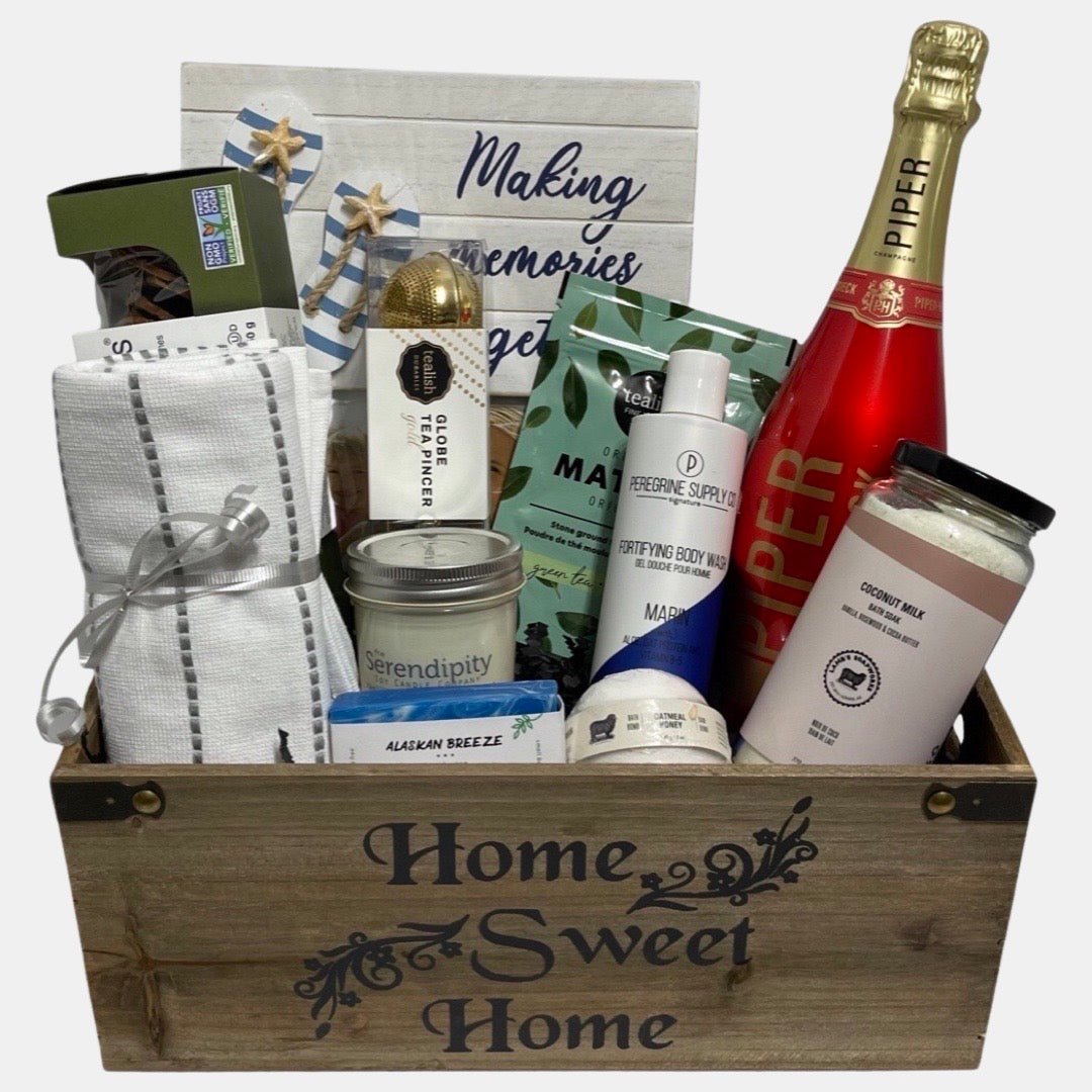 A bottle of champagne, spa products, photo frame in a  beautiful wooden housewarming gift basket  Calgary.