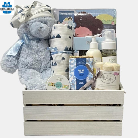 A Baby gift basket that has essential baby products, a stuffed bear toy & a rhyme book 