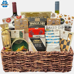 Calgary gift basket that includes delicious gourmet snacks, chocolates, cheese and two bottles of wines organized in a rectangular corn market tray. 