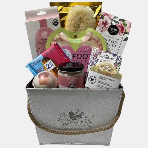 This opulent made in Calgary gift basket includes a range of quality spa products and Spa tea and chocolates arranged in a white metal basket.