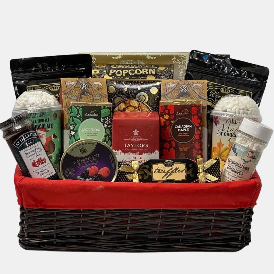 A Calgary gift basket made in a willow basket that contains multiple hot chocolates in different flavours along with delicious gourmet snacks.