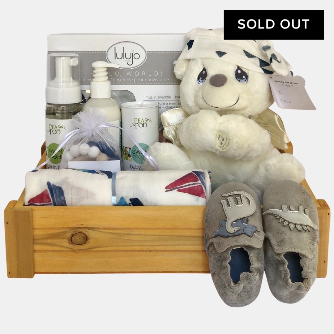 A made in Calgary gender neutral beautiful gift basket for a baby. It includes everything that baby will need during the first few months.Great gift for newborn.